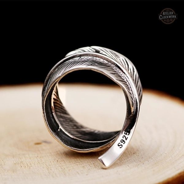 Accessoire homme argent avec motif plume unique