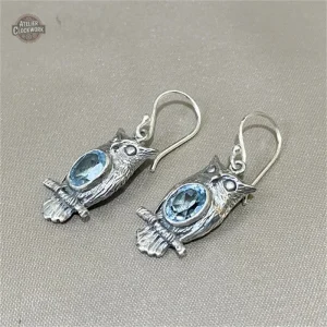Création originale de boucles d'oreilles hibou