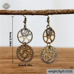 Boucles femme avec motifs de rouages et chaînes