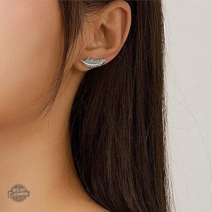 Accessoire féminin steampunk en plumes argentées