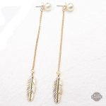 Boucles Steampunk en plumes dorées