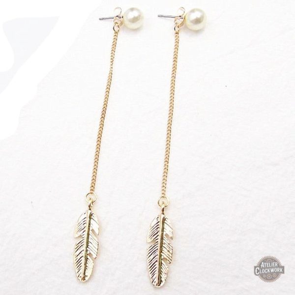 boucles-d-oreilles-pendantes-longues-steampunk-store-1 Boucles Steampunk en plumes dorées