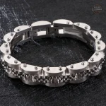 Bracelet dandy en acier et or intemporel