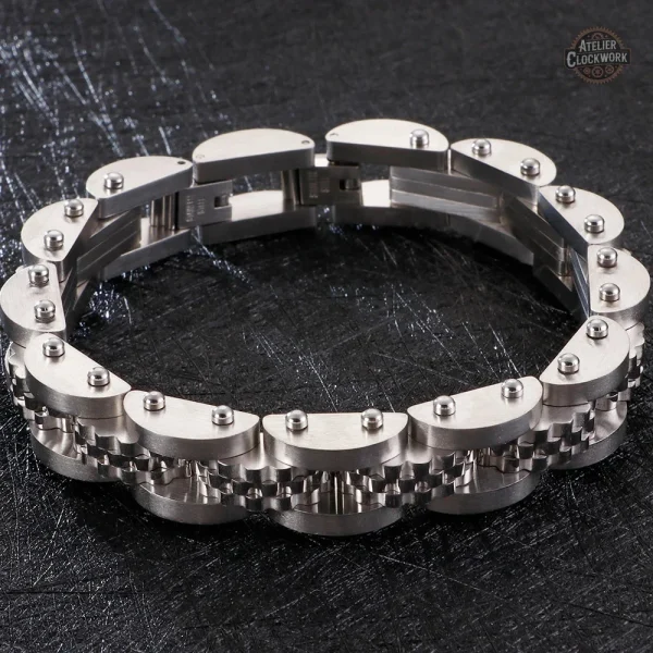 Bracelet dandy en acier et or intemporel