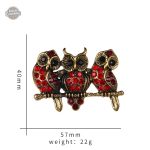 Broche originale steampunk avec motif de chouettes rouges