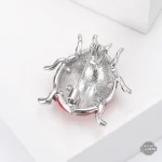 Broche steampunk, coccinelle pour une touche d'originalité
