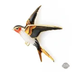 Broche oiseau, un voyage entre passé et futur