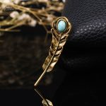 Broche originale en forme de plume de paon