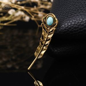 Broche originale en forme de plume de paon