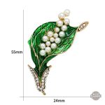 Broche au design steampunk, émail vert sur une base délicate