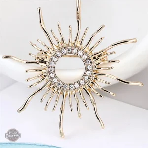 Broche rétro au design soleil élégant